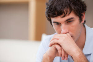 Man Thinking About Attending an Inpatient Drug Rehab Program