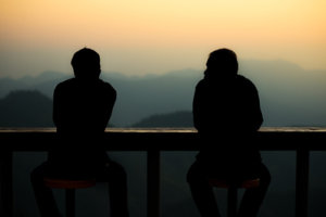Two Men Watching the Sunset as They Embrace Alcohol Recovery