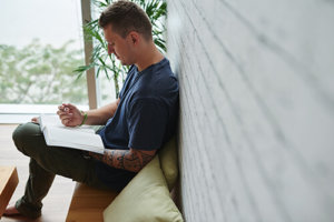 Man Reading at Our Alcohol Recovery Center