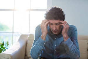man struggling with cocaine abuse symptoms