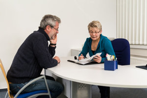 Counselor Giving Man a Drug and Alcohol Assessment