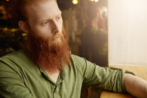bearded man thinking about enrolling in meth addiction treatment