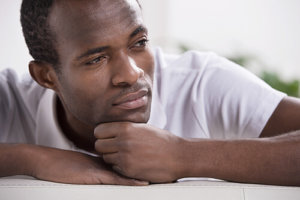 man contemplates enrolling in a rehab addiction center
