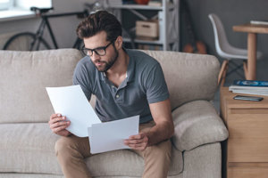 Man Analyzing Rehab Financing Options