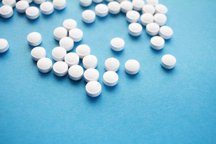 scattered white pills