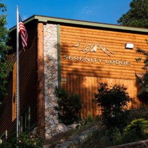 Serenity Lodge Sign and the American Flag
